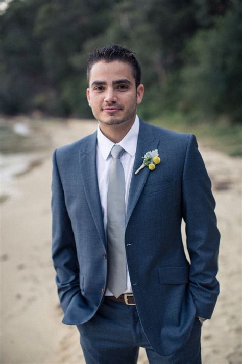 navy suit with silver tie.